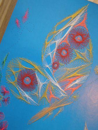 Фрагмент вышивания бабочек